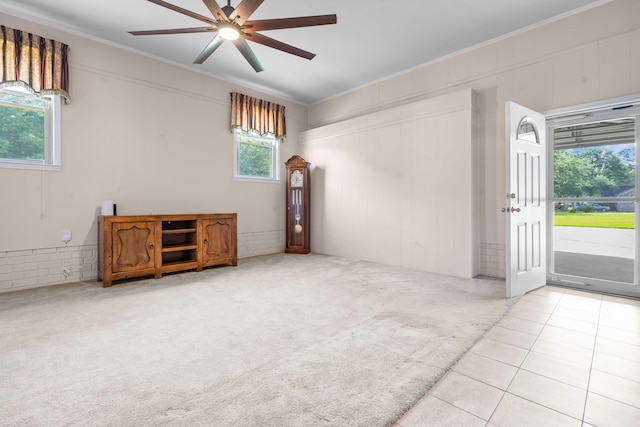101 Parkside Dr, Goose Creek, SC 29445 - carpeted empty room with a ceiling fan, ornamental molding, and tile patterned flooring