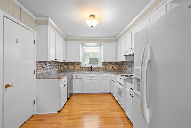101 Parkside Dr, Goose Creek, SC 29445 - kitchen with white appliances, under cabinet range hood, a sink, light wood-type flooring, and white cabinets