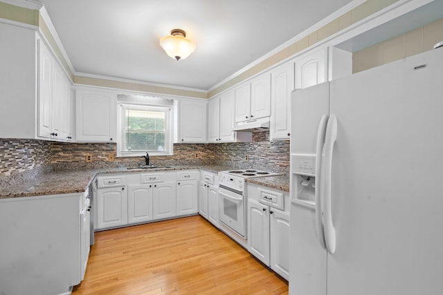 101 Parkside Dr, Goose Creek, SC 29445 - kitchen with white appliances, a sink, under cabinet range hood, backsplash, and light wood finished floors
