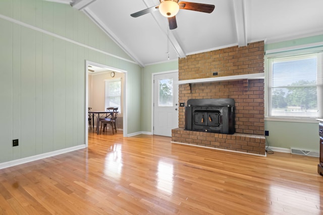 101 Parkside Dr, Goose Creek, SC 29445 - unfurnished living room with wood finished floors, a ceiling fan, a wood stove, and baseboards