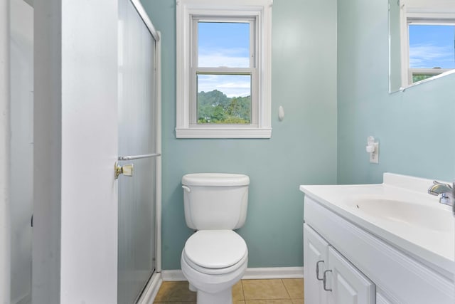 101 Parkside Dr, Goose Creek, SC 29445 - full bath featuring vanity, toilet, a shower stall, tile patterned flooring, and baseboards