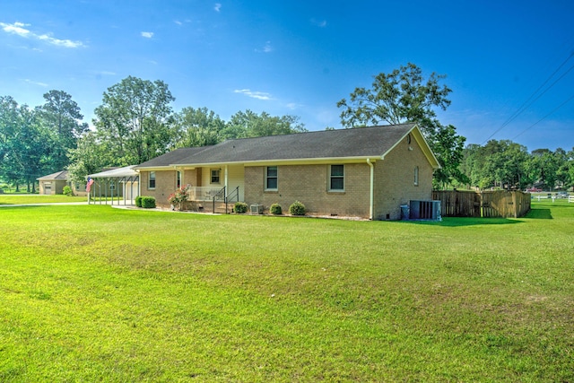 101 Parkside Dr, Goose Creek, SC 29445 - rear view of house featuring brick siding, central AC, a carport, and crawl space
