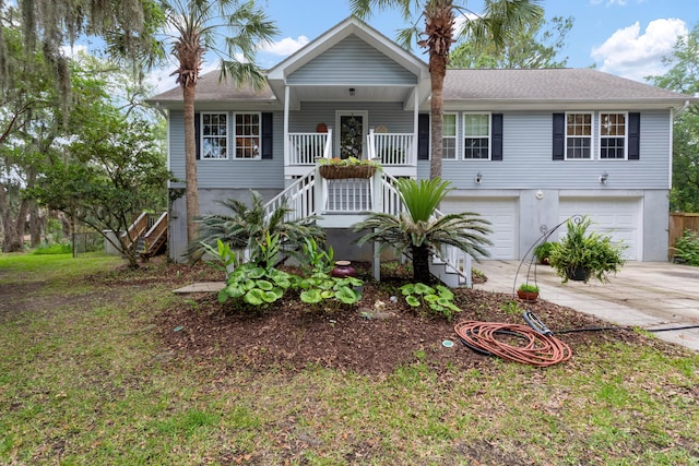 1604 Macoma Dr, Mount Pleasant, SC 29466 - view of front of home featuring stairway, concrete driveway, an attached garage, and a porch