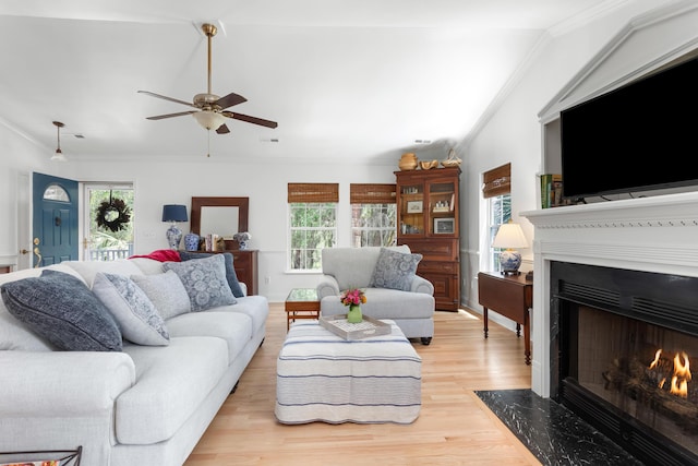 1604 Macoma Dr, Mount Pleasant, SC 29466 - living area with ornamental molding, light wood-type flooring, a fireplace with flush hearth, healthy amount of natural light, and ceiling fan