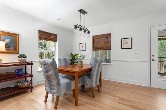 1604 Macoma Dr, Mount Pleasant, SC 29466 - dining area with light wood-style floors, ornamental molding, plenty of natural light, and baseboards
