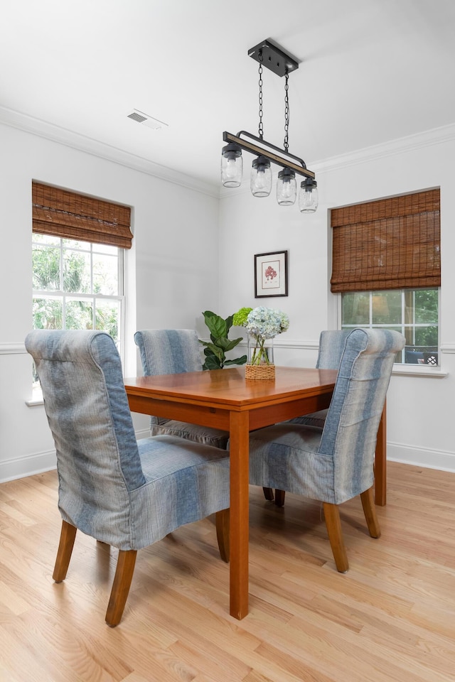 1604 Macoma Dr, Mount Pleasant, SC 29466 - dining space with crown molding, light wood-type flooring, and baseboards