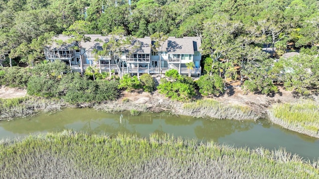 birds eye view of property with a water view