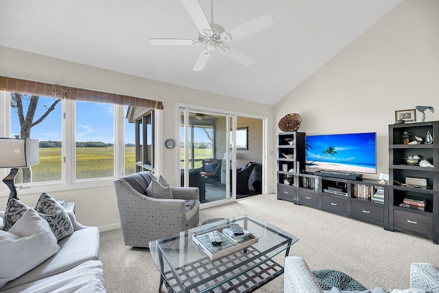 living room with ceiling fan, light carpet, lofted ceiling, and a wealth of natural light