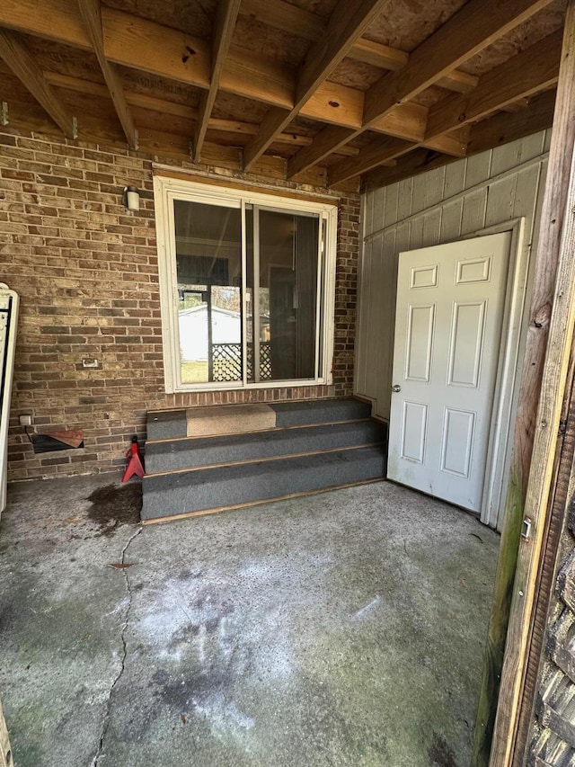 property entrance with brick siding