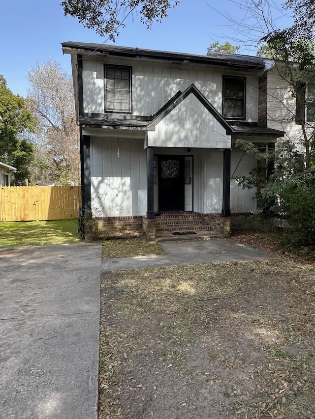 view of front of house featuring fence