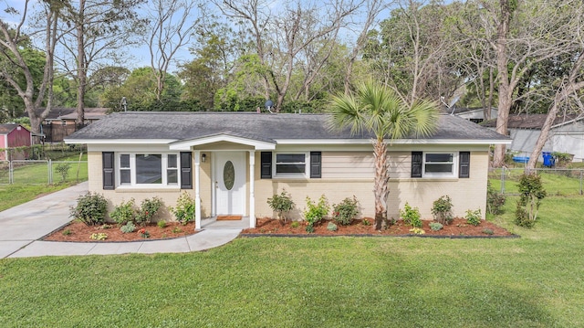 1239 Old Orchard Rd, Charleston, SC 29412 - ranch-style home featuring brick siding, a front lawn, fence, and a shingled roof