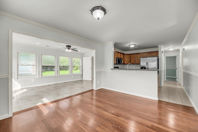 1239 Old Orchard Rd, Charleston, SC 29412 - unfurnished living room featuring ceiling fan, light wood finished floors, baseboards, and ornamental molding