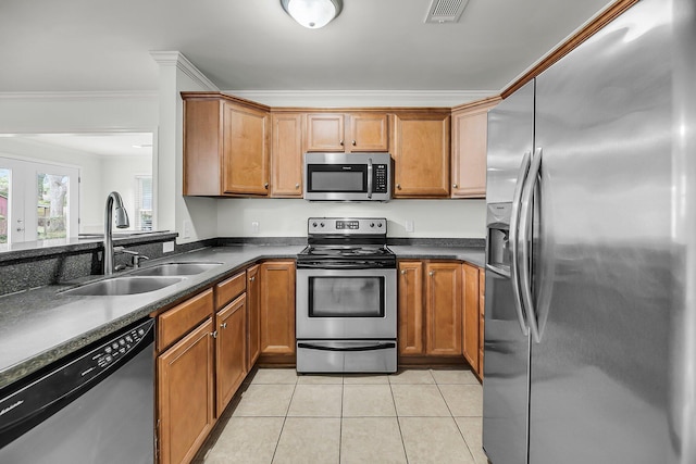 1239 Old Orchard Rd, Charleston, SC 29412 - kitchen featuring visible vents, a sink, ornamental molding, stainless steel appliances, and light tile patterned flooring