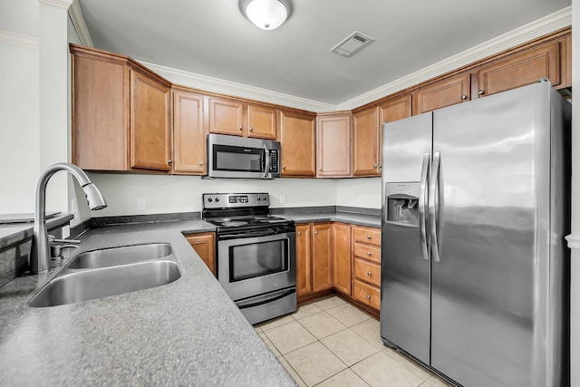 1239 Old Orchard Rd, Charleston, SC 29412 - kitchen with light tile patterned floors, visible vents, brown cabinets, stainless steel appliances, and a sink