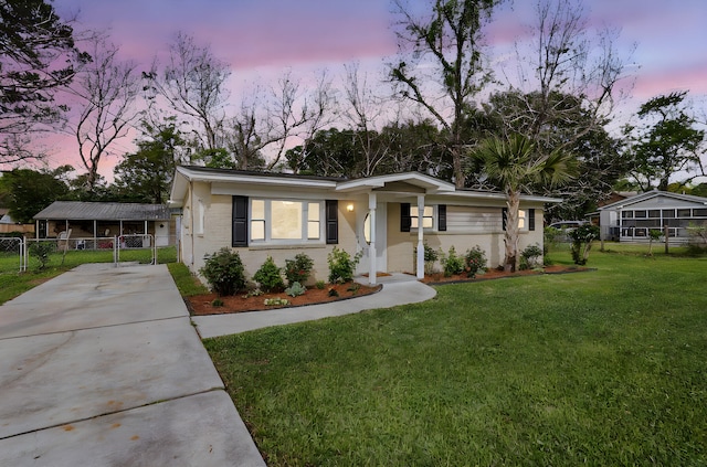 1239 Old Orchard Rd, Charleston, SC 29412 - ranch-style home with brick siding, a front lawn, fence, and driveway