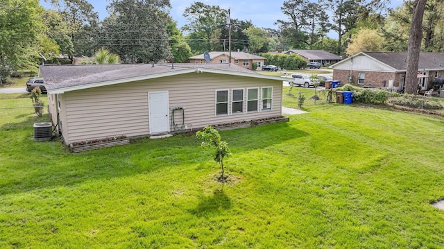 1239 Old Orchard Rd, Charleston, SC 29412 - back of house with fence, a lawn, and central air condition unit