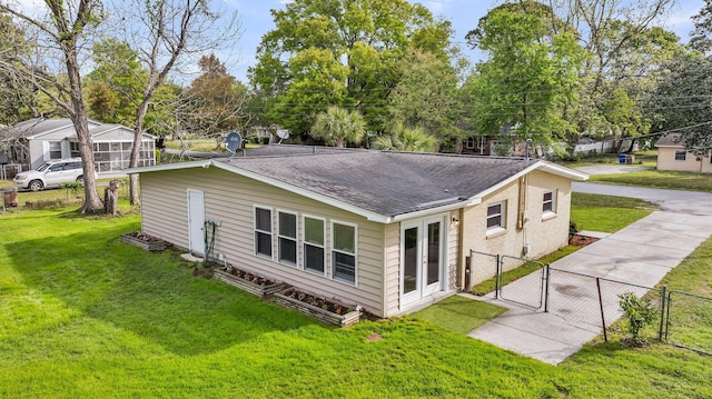 1239 Old Orchard Rd, Charleston, SC 29412 - back of house featuring roof with shingles, a yard, fence, and a gate