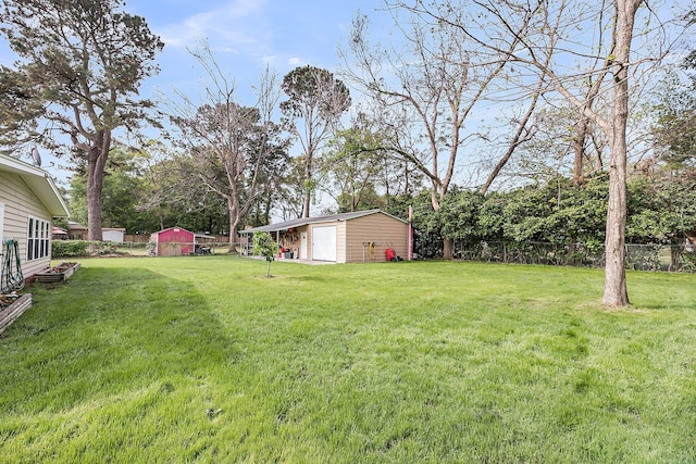 1239 Old Orchard Rd, Charleston, SC 29412 - view of yard with fence, an outbuilding, and a detached garage