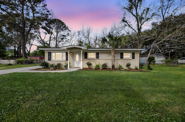 1239 Old Orchard Rd, Charleston, SC 29412 - view of front facade featuring driveway, fence, and a lawn