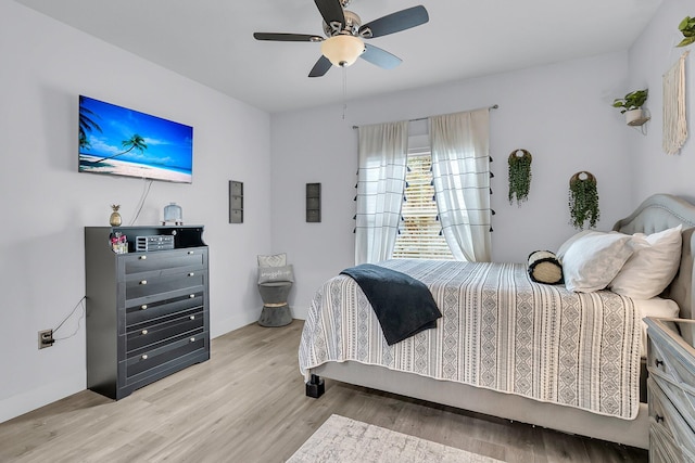 bedroom with ceiling fan and light wood-type flooring