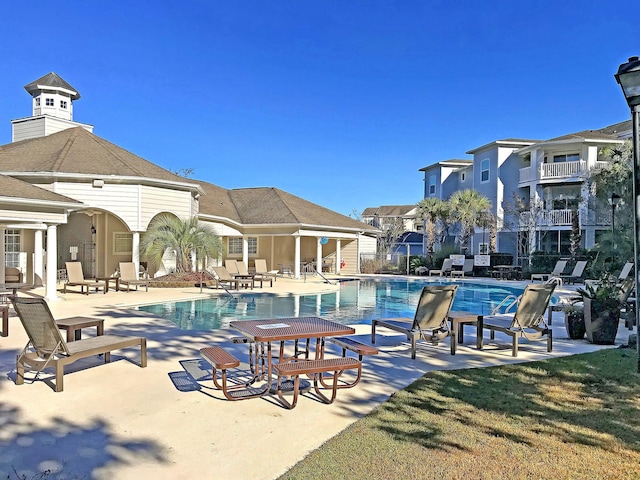 view of swimming pool featuring a patio