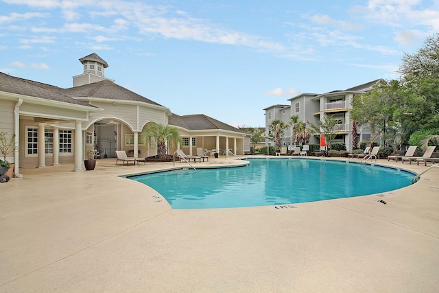 view of swimming pool with a patio