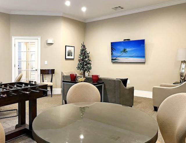 dining room with carpet and ornamental molding