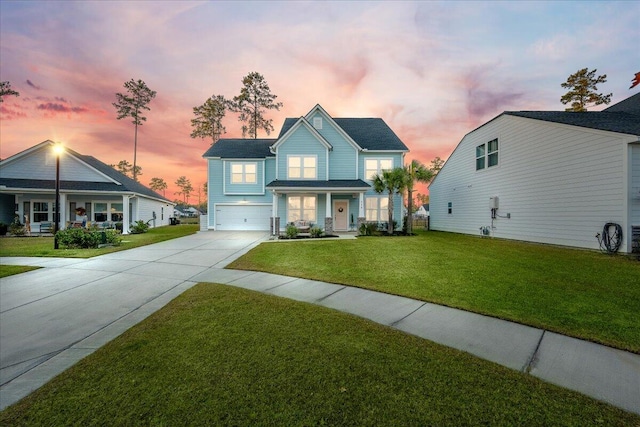 view of front of house with a lawn and a garage