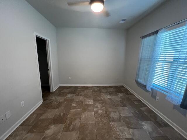 unfurnished room featuring ceiling fan