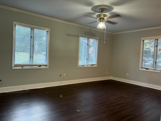 empty room featuring ceiling fan, ornamental molding, and a wealth of natural light