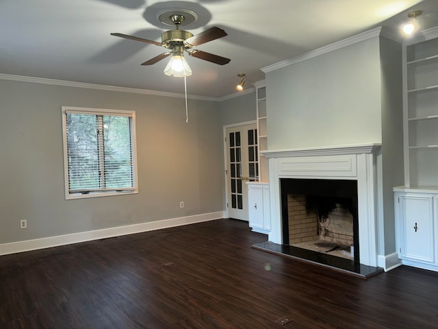 unfurnished living room with ceiling fan, built in shelves, crown molding, and dark wood-type flooring