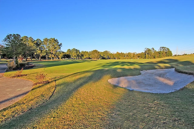 8662 W Fairway Woods Dr, North Charleston, SC 29420 - view of home's community with view of golf course and a lawn