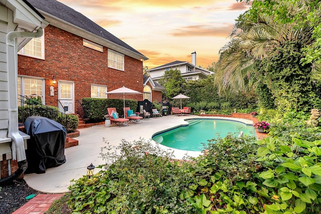 8662 W Fairway Woods Dr, North Charleston, SC 29420 - view of swimming pool with a patio and grilling area