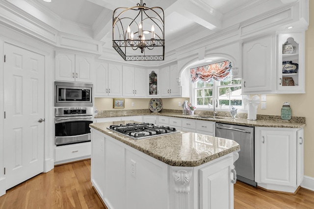 8662 W Fairway Woods Dr, North Charleston, SC 29420 - kitchen with stainless steel appliances, a sink, white cabinets, beamed ceiling, and glass insert cabinets