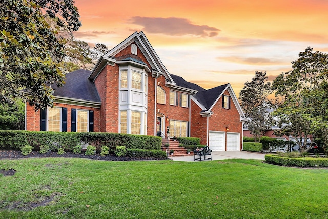8662 W Fairway Woods Dr, North Charleston, SC 29420 - view of front of property featuring brick siding, a garage, a front yard, driveway, and a shingled roof