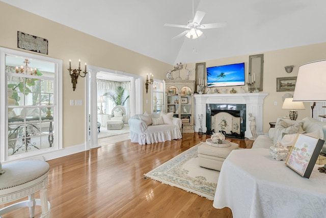 8662 W Fairway Woods Dr, North Charleston, SC 29420 - living area with wood finished floors, high vaulted ceiling, ceiling fan, and a fireplace