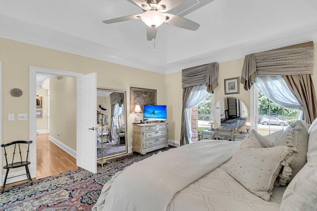 8662 W Fairway Woods Dr, North Charleston, SC 29420 - bedroom with wood finished floors, a ceiling fan, crown molding, access to outside, and baseboards