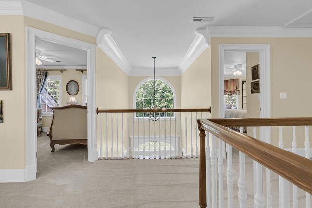 8662 W Fairway Woods Dr, North Charleston, SC 29420 - corridor with ornamental molding, carpet flooring, an upstairs landing, a chandelier, and baseboards