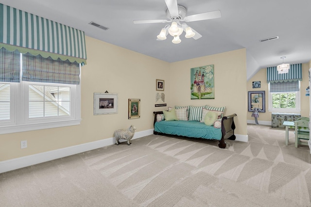 8662 W Fairway Woods Dr, North Charleston, SC 29420 - carpeted bedroom with baseboards, ceiling fan, and a chandelier