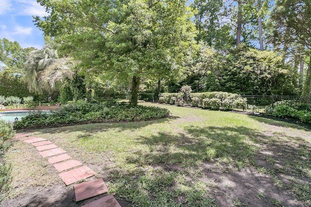 8662 W Fairway Woods Dr, North Charleston, SC 29420 - view of yard featuring view of wooded area