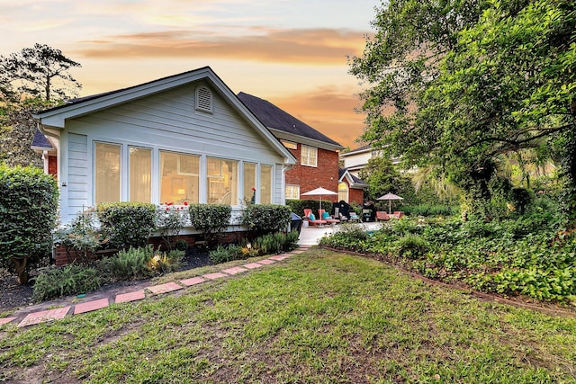 8662 W Fairway Woods Dr, North Charleston, SC 29420 - back of house with a yard and a patio
