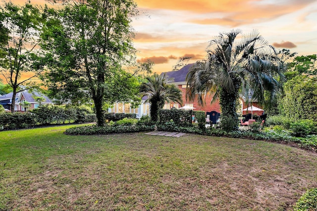 8662 W Fairway Woods Dr, North Charleston, SC 29420 - yard at dusk featuring a yard