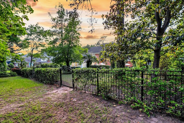 8662 W Fairway Woods Dr, North Charleston, SC 29420 - view of yard at dusk