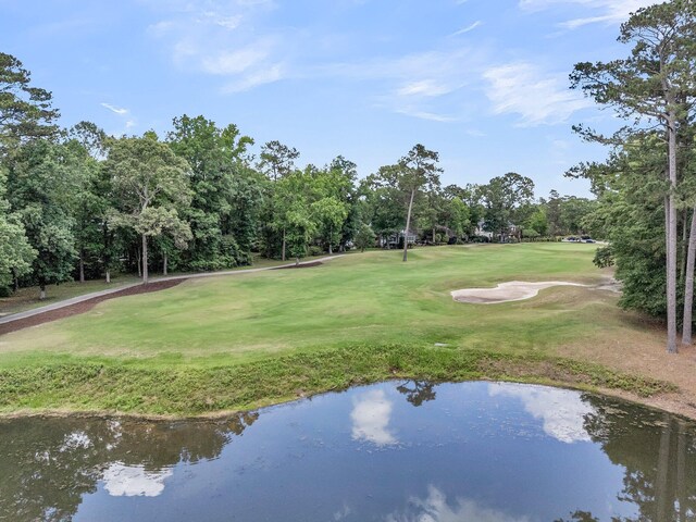 8662 W Fairway Woods Dr, North Charleston, SC 29420 - view of community featuring view of scattered trees, a yard, golf course view, and a water view