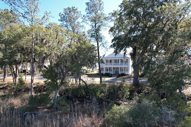 back of property with a balcony