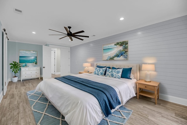 bedroom featuring visible vents, baseboards, light wood-type flooring, recessed lighting, and a ceiling fan