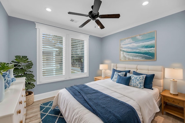 bedroom featuring visible vents, baseboards, recessed lighting, light wood-style flooring, and a ceiling fan