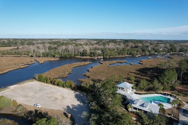 bird's eye view with a wooded view and a water view