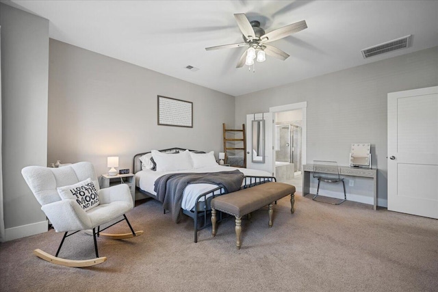 bedroom featuring connected bathroom, carpet flooring, and ceiling fan