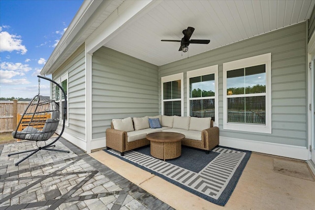 view of patio with ceiling fan, fence, and an outdoor living space